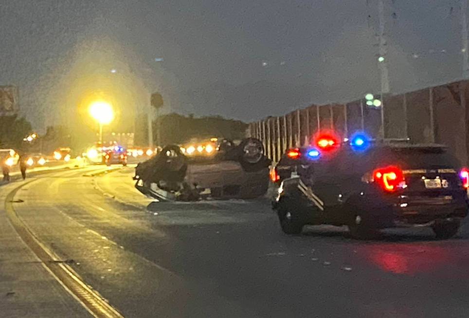 A Hummer H2 rests on its roof after a fatal wrong-way crash on U.S. Highway 95 near Russell Roa ...