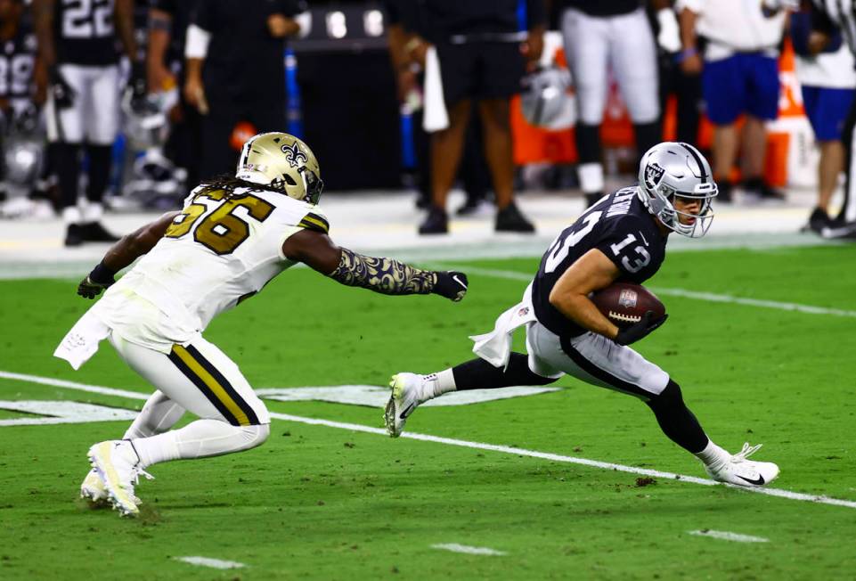 Las Vegas Raiders wide receiver Hunter Renfrow (13) runs the ball past New Orleans Saints outsi ...