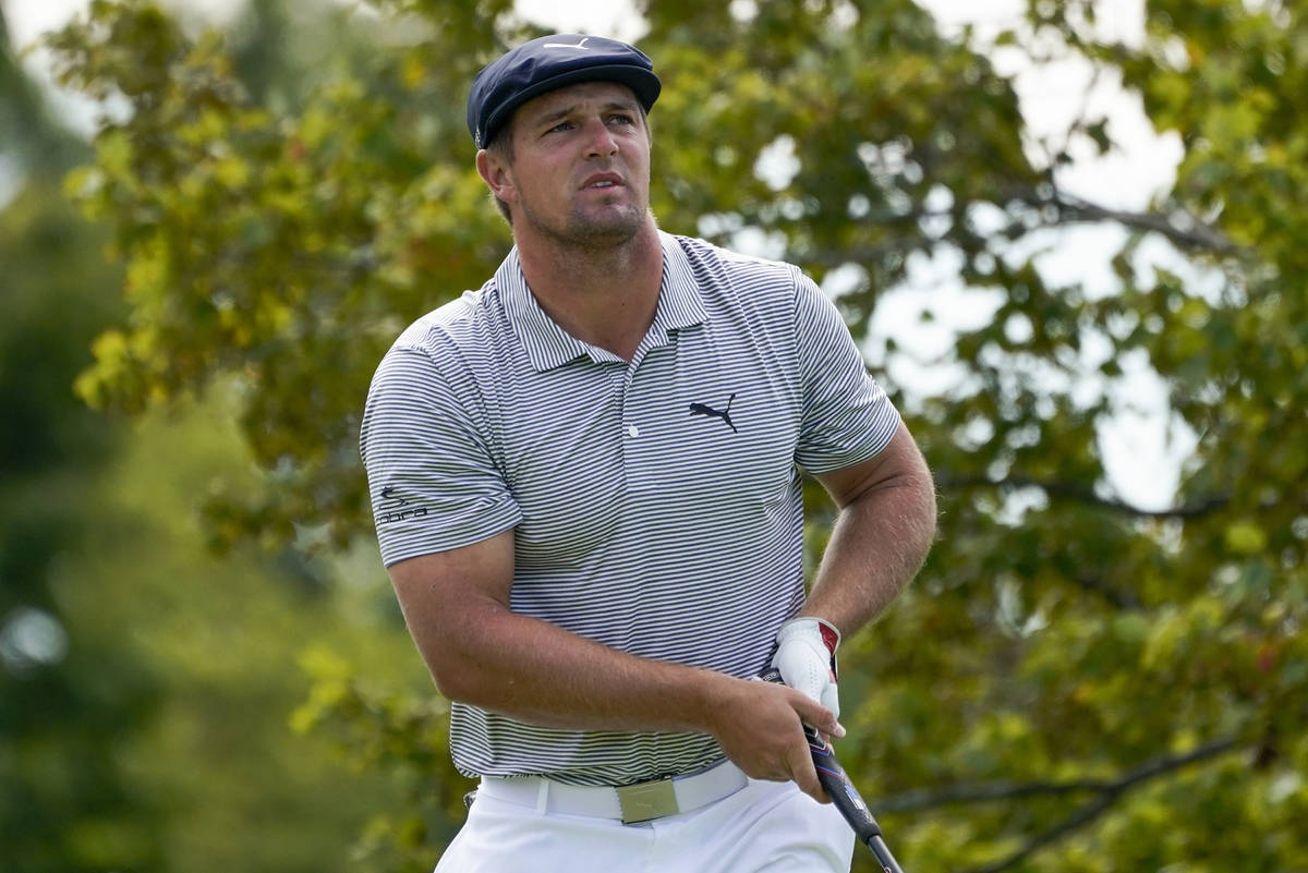 Bryson DeChambeau, of the United States, watches his shot off the second tee during the final r ...