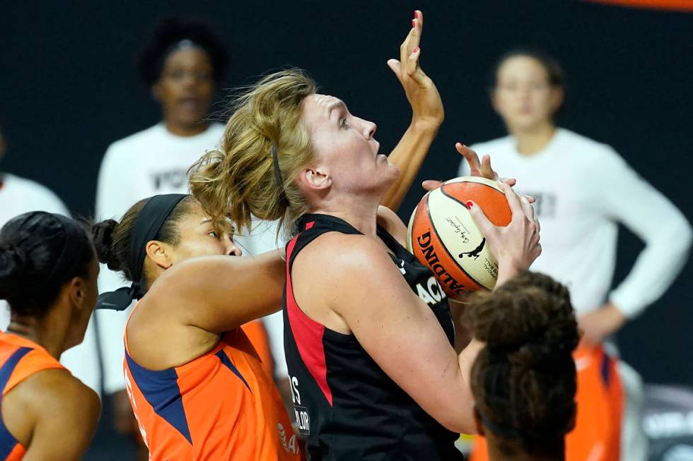 Las Vegas Aces center Carolyn Swords (4) loses control of the ball after getting hit by Connect ...