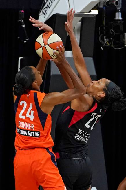 Connecticut Sun forward DeWanna Bonner (24) shoots against Las Vegas Aces center A'ja Wilson (2 ...