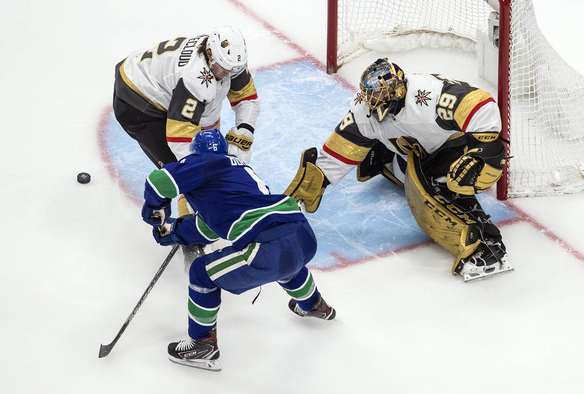 Vegas Golden Knights goalie Marc-Andre Fleury (29) makes the save as Vancouver Canucks' Brock B ...