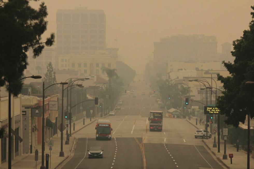 Smoke from wildfires fills the sky over Pasadena, Calif. (AP Photo/John Antczak)