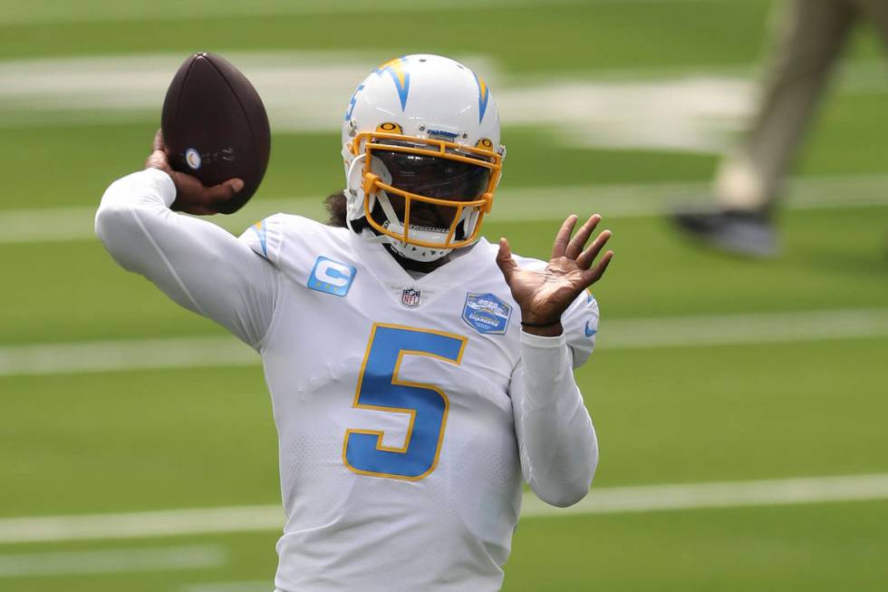 Los Angeles Chargers quarterback Tyrod Taylor (5) warms up before an NFL football game between ...