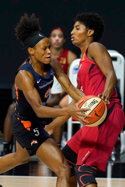 Connecticut Sun guard Jasmine Thomas (5) runs into Las Vegas Aces forward Angel McCoughtry (35) ...