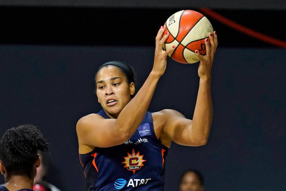 Connecticut Sun center Brionna Jones (42) grabs a rebound against the Las Vegas Aces during the ...