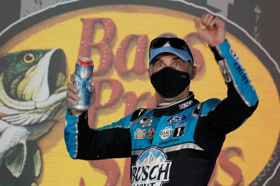 Kevin Harvick celebrates in Victory Lane after his win in the NASCAR Cup Series auto race Satur ...