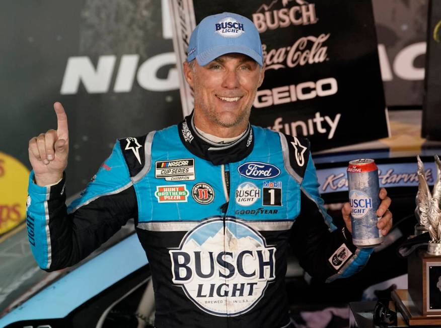 Kevin Harvick celebrates in Victory Lane after winning the NASCAR Cup Series auto race Saturday ...