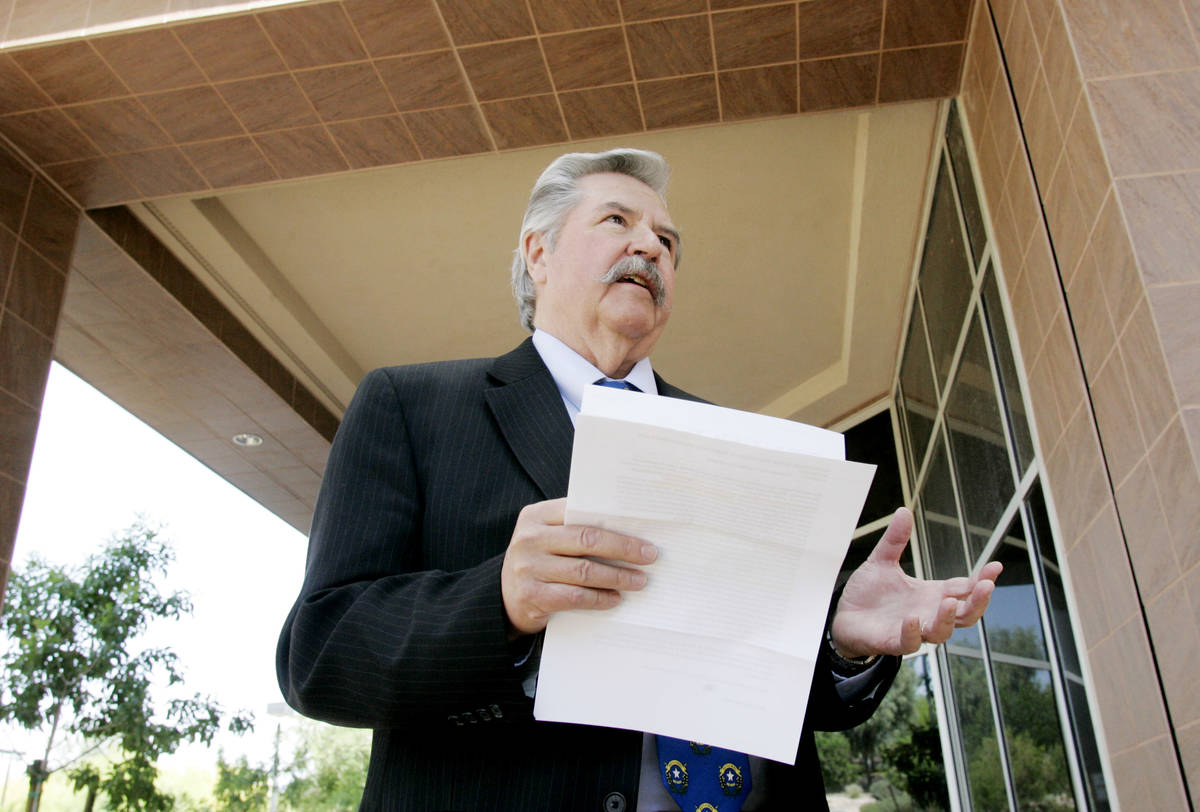 Former Las Vegas Review-Journal editor Thomas Mitchell holds a press conference outside the Gra ...