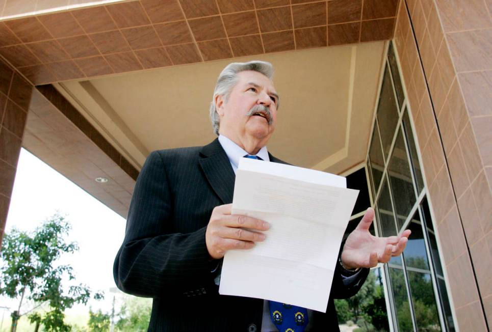 Former Las Vegas Review-Journal editor Thomas Mitchell holds a press conference outside the Gra ...