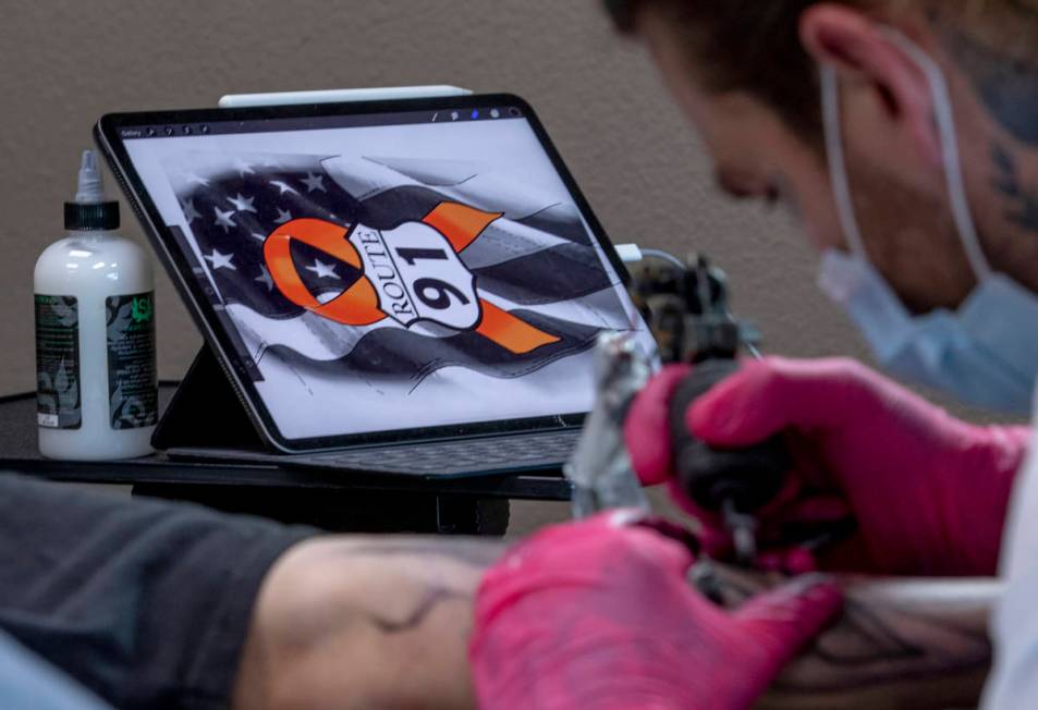 Tattoo artist Jimmy Snaz recreates his computer drawing on Joe Gerransnas Route 91 shooting sur ...
