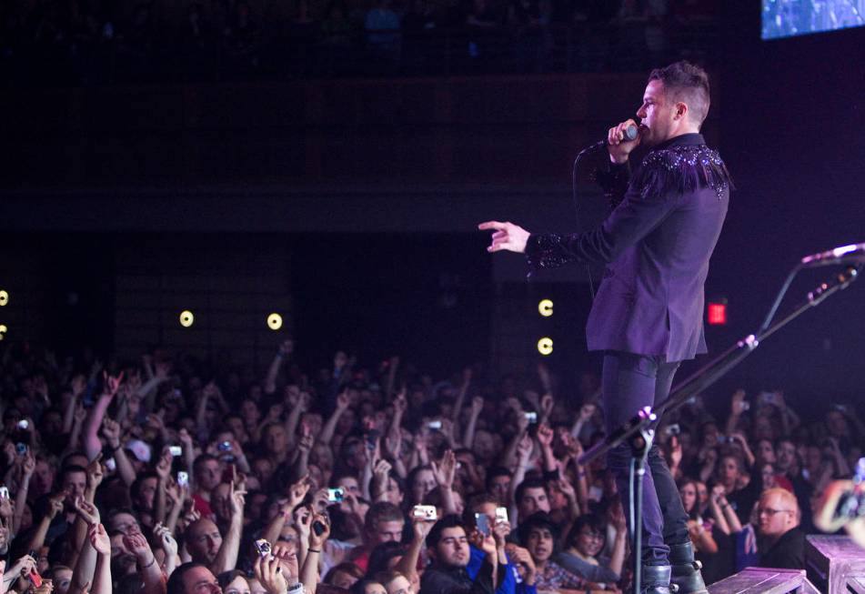 Brandon Flowers of The Killers performs with the band to a sold-out crowd during the opening ni ...