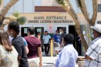 People wait in line at the Nevada Department of Motor Vehicles at 8250 West Flamingo Road on Mo ...