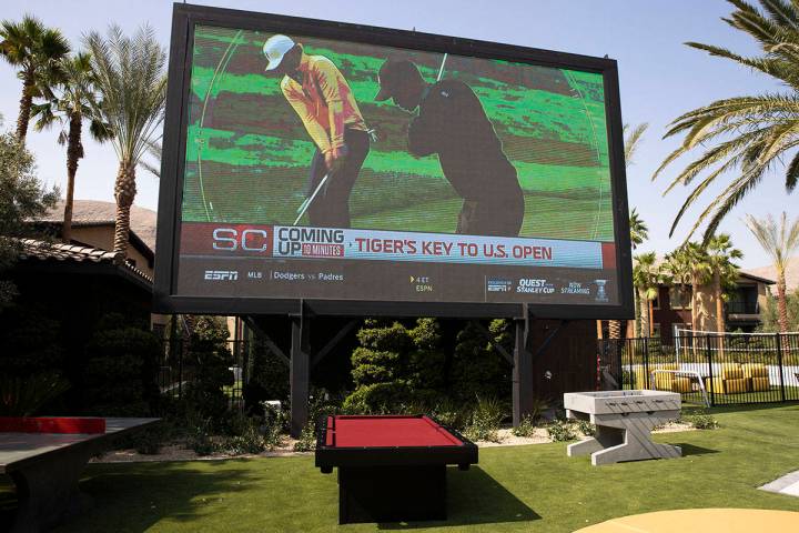 A giant television, ping pong table and pool table are seen near a pool area at the Tuscan High ...