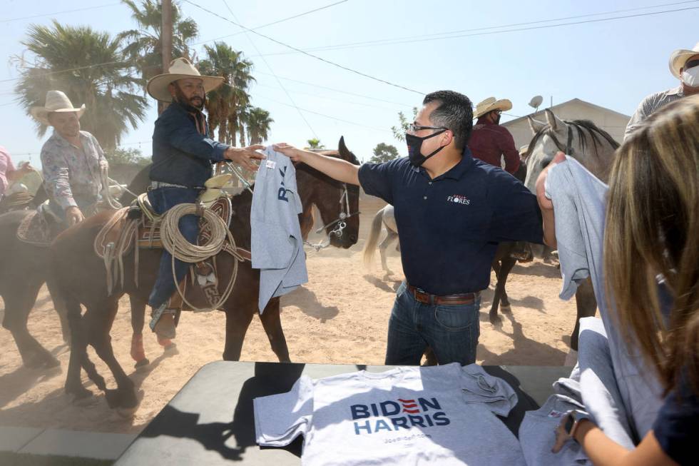Assemblyman Edgar Flores gives away Biden Harris shirts to horseback riders during his re-elect ...