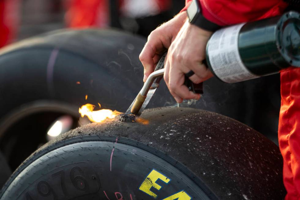 A member of Michael Annett's (1) crew burns rubber off a tire during the NASCAR Xfinity Series ...