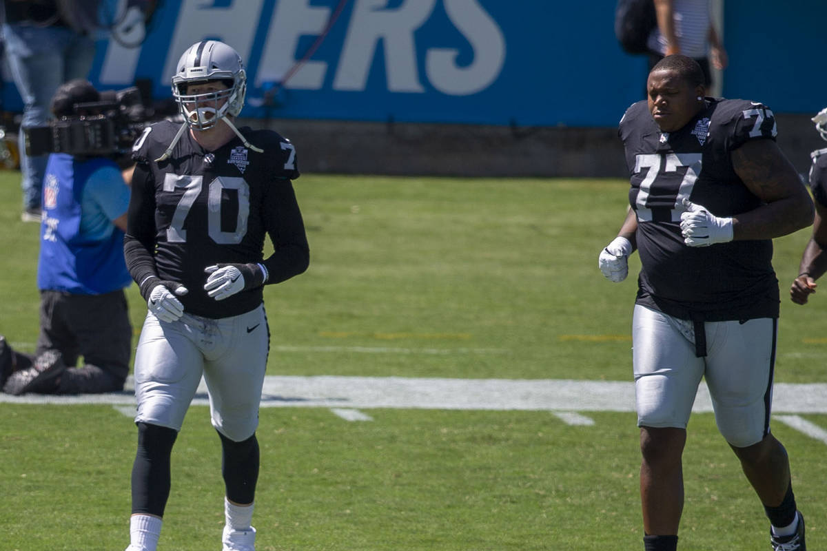 Las Vegas Raiders offensive tackle Sam Young (70), offensive tackle Trent Brown (77) and wide ...