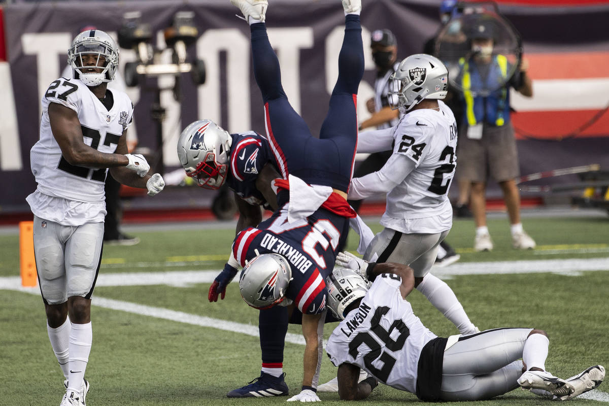 New England Patriots running back Rex Burkhead (34) leaps into the end zone for a touchdown pas ...