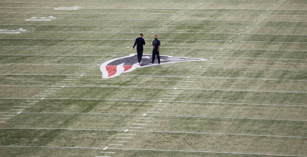 New England Patriots players do a walk through before the start of an NFL football game with th ...