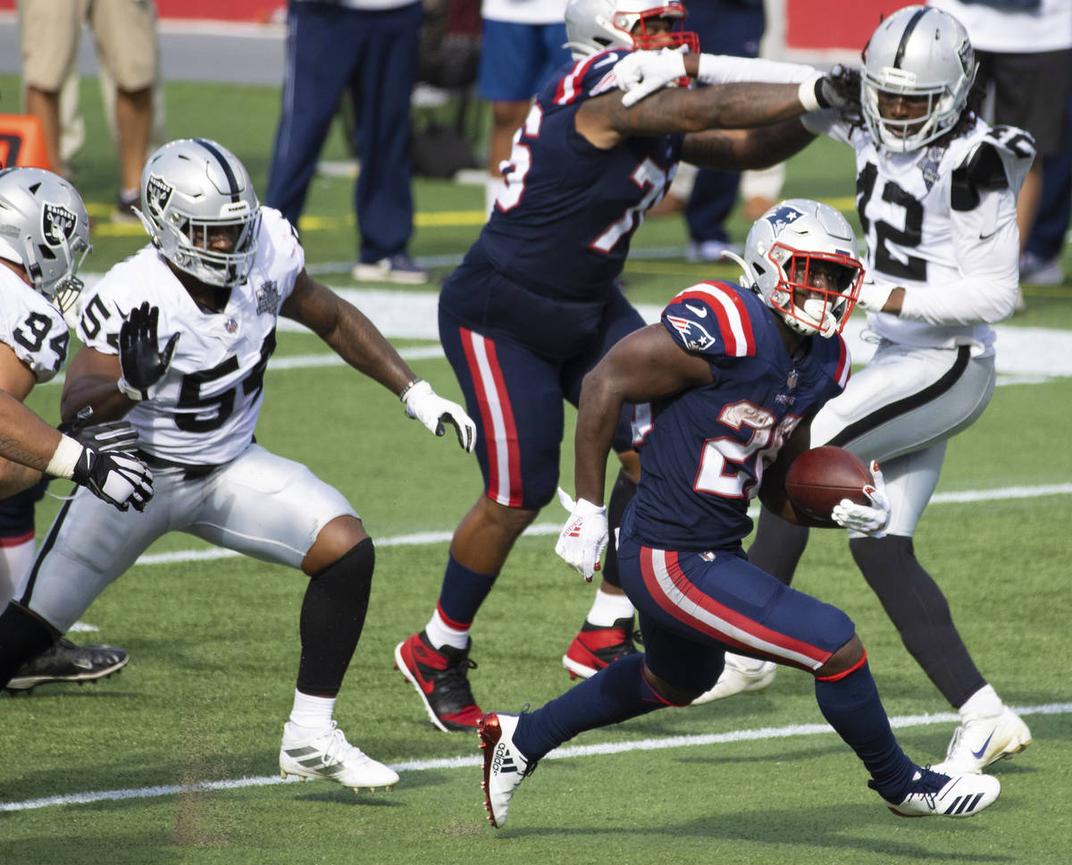 New England Patriots running back Sony Michel (26) breaks into the open field past Las Vegas Ra ...