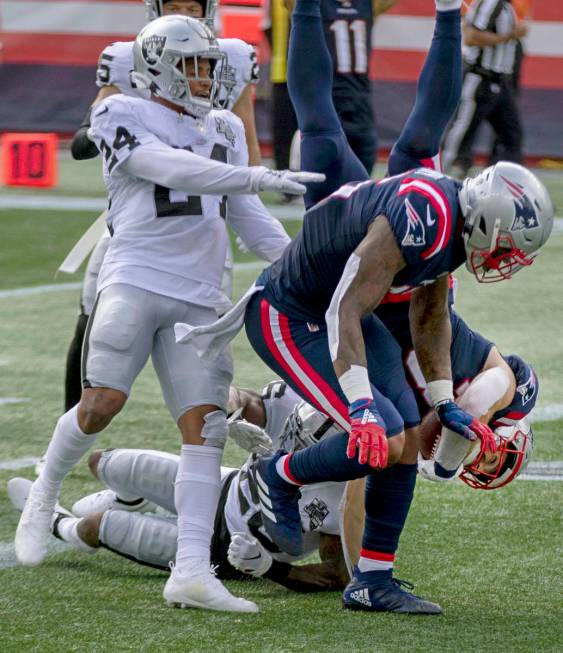 New England Patriots running back Rex Burkhead (34) dives into the end zone past Las Vegas Raid ...