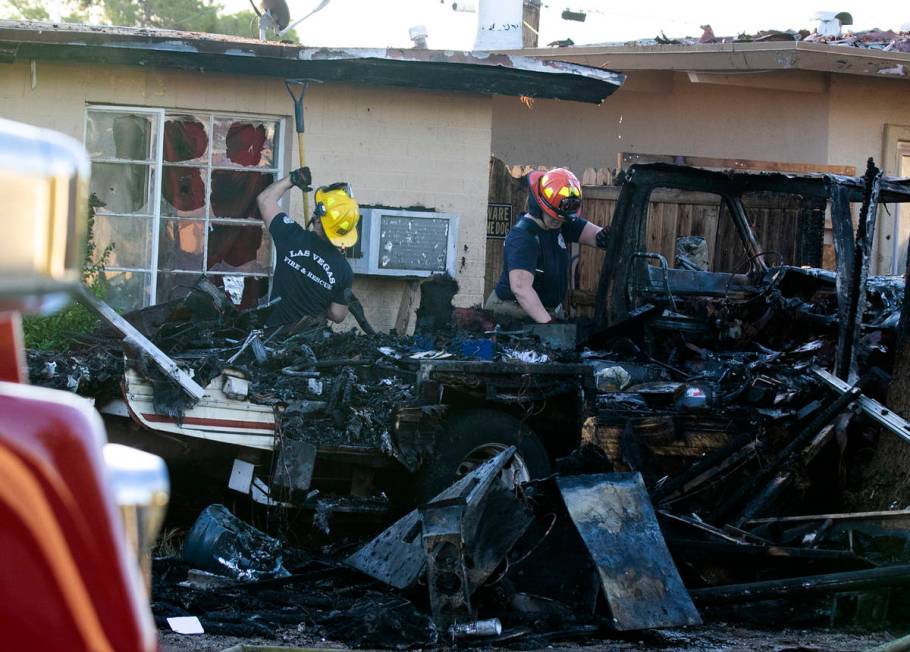 A fire in a recreation vehicle damaged two homes and another vehicle near West Decatur Boulevar ...