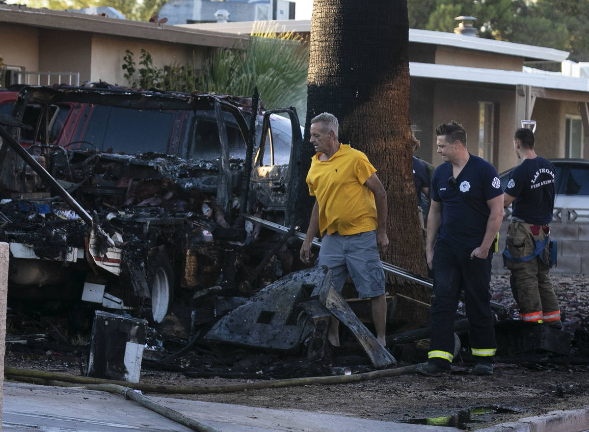 A fire in a recreation vehicle damaged two homes and another vehicle near West Decatur Boulevar ...