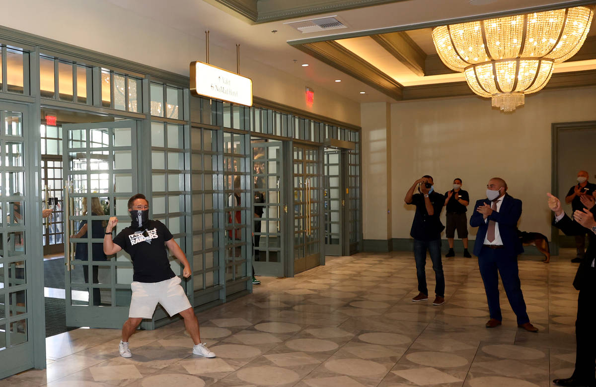 Kohei Munemura of Las Vegas is the first customer through the doors as Park MGM reopens after t ...