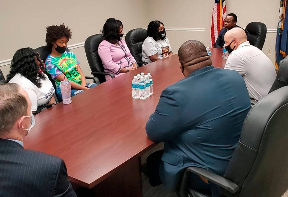 Tamika Palmer, far left, the mother of Breonna Taylor, and other family members meet with Kentu ...