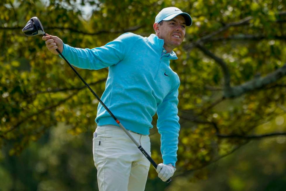 Rory McIlroy, of Northern Ireland, watches his shot from the second tee during the final round ...