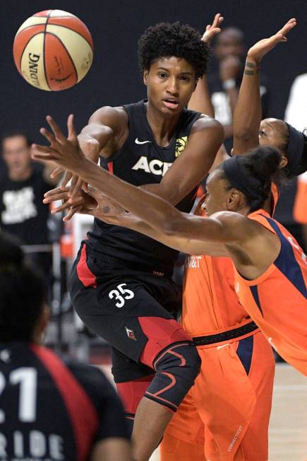 Las Vegas Aces forward Angel McCoughtry (35) passes the ball in front of Connecticut Sun guard ...