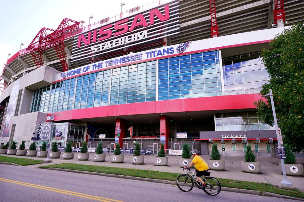 A cyclist passes by Nissan Stadium, home of the Tennessee Titans, Tuesday, Sept. 29, 2020, in N ...