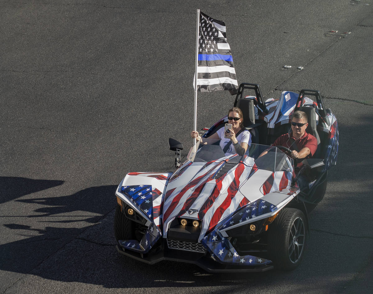 A car taking part in a caravan of Trump and police support, rides down the Las Vegas Strip, on ...