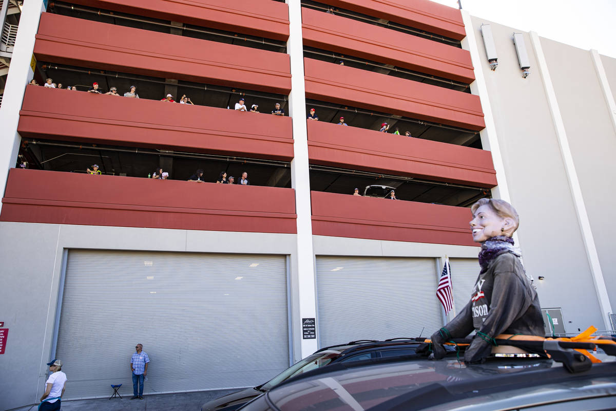 People watch from the parking garage of the Ahern Hotel as supporters of law enforcement and Pr ...