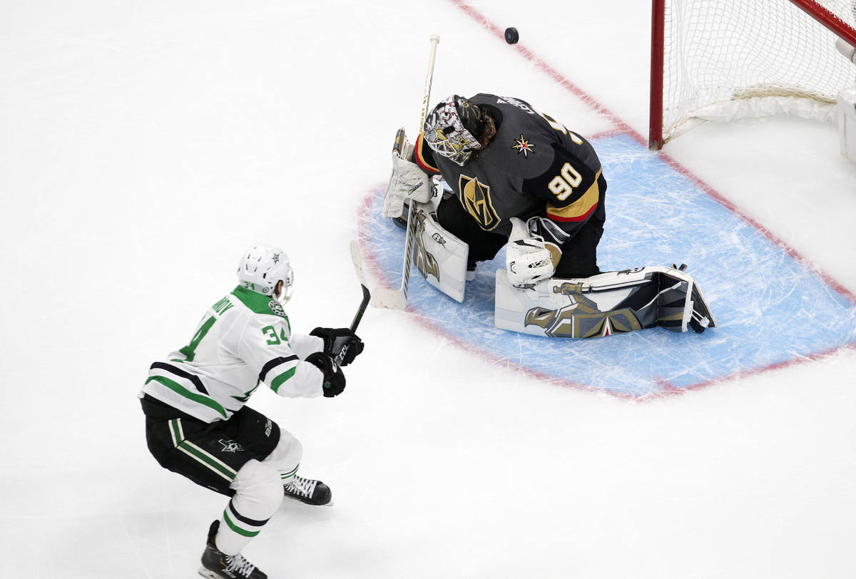 Dallas Stars' Denis Gurianov (34) is stopped by Vegas Golden Knights goalie Robin Lehner (90) d ...