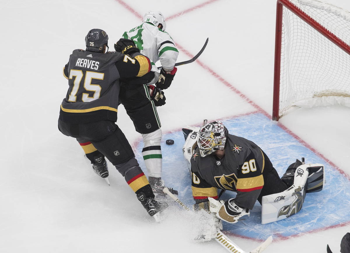 Dallas Stars' Jamie Benn (14) is stopped by Vegas Golden Knights' goalie Robin Lehner (90) as G ...