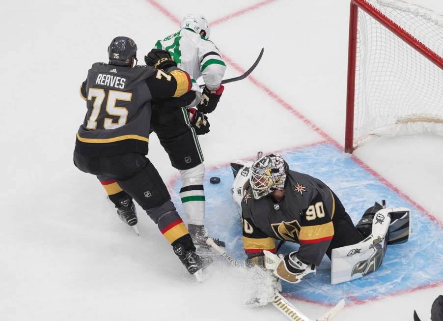 Dallas Stars' Jamie Benn (14) is stopped by Vegas Golden Knights' goalie Robin Lehner (90) as G ...