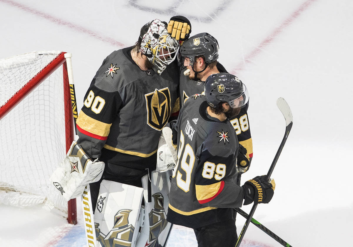 Vegas Golden Knights goalie Robin Lehner (90) and teammates Nate Schmidt (88) and Alex Tuch (89 ...