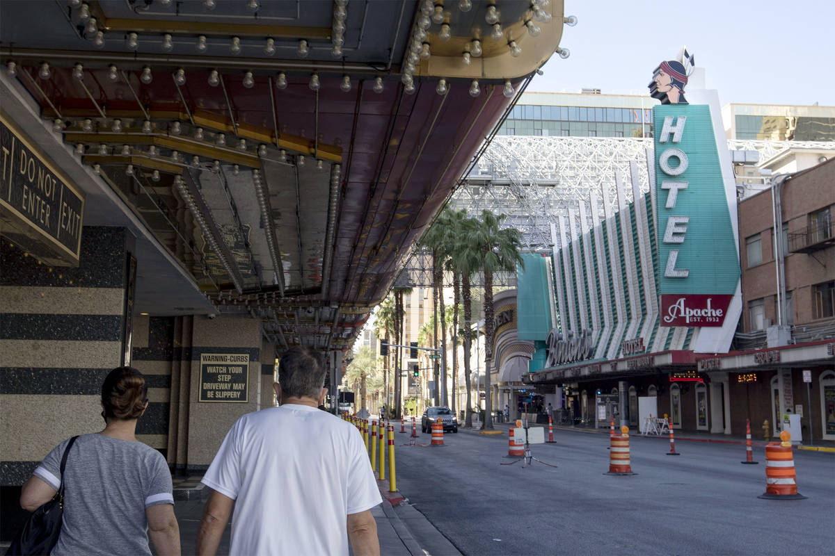 People walk by Hotel Apache in downtown Las Vegas on Tuesday, Sept. 29, 2020. (Ellen Schmidt/La ...