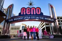 Taking in the pink lights of the Reno Arch in October 2019 are some of Paint Nevada Pink’s or ...