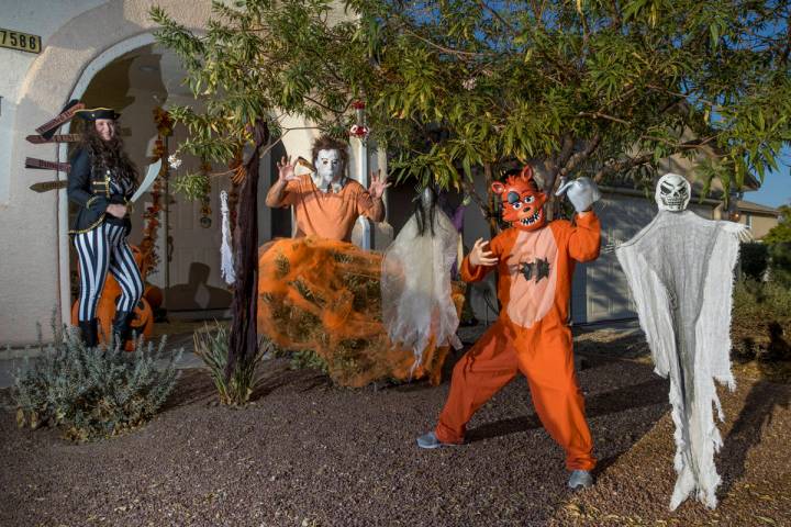 (from right) Alex Montenegro, 8, with parents Joe and Kim Cabrero in costumes with their home d ...