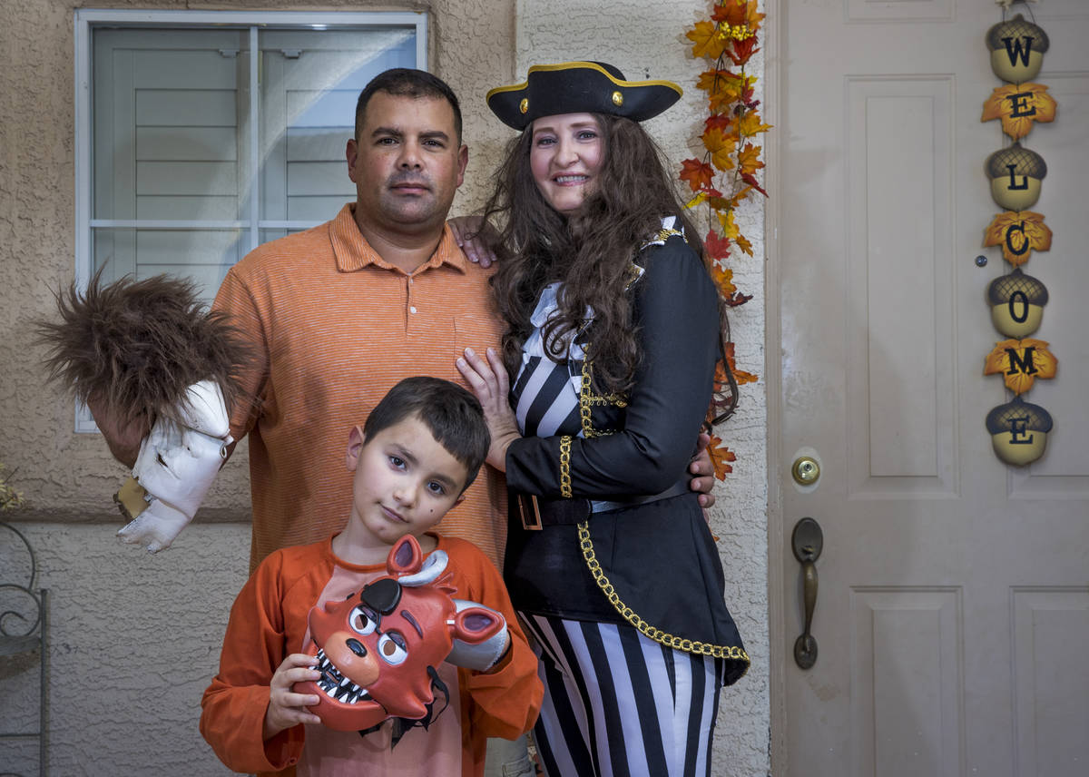 (Clockwise from bottom) Alex Montenegro, 8, with parents Joe and Kim Cabrero in costumes with t ...