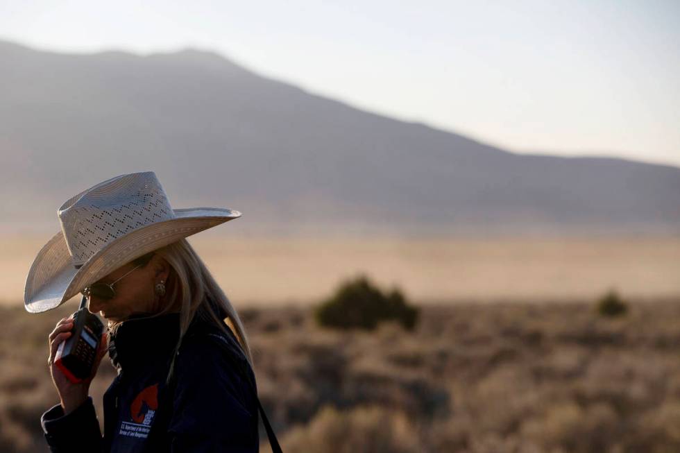 U.S. Bureau of Land Management spokeswoman Jenny Lesieutre speaks with incident command via rad ...