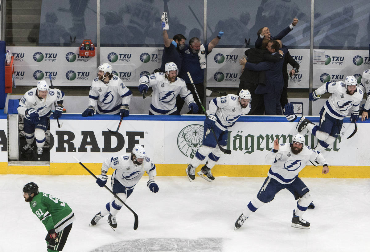 Tampa Bay Lightning players celebrate after defeating the Dallas Stars to win the Stanley Cup i ...