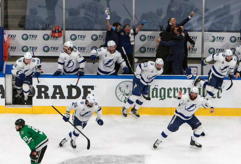 Tampa Bay Lightning players celebrate after defeating the Dallas Stars to win the Stanley Cup i ...