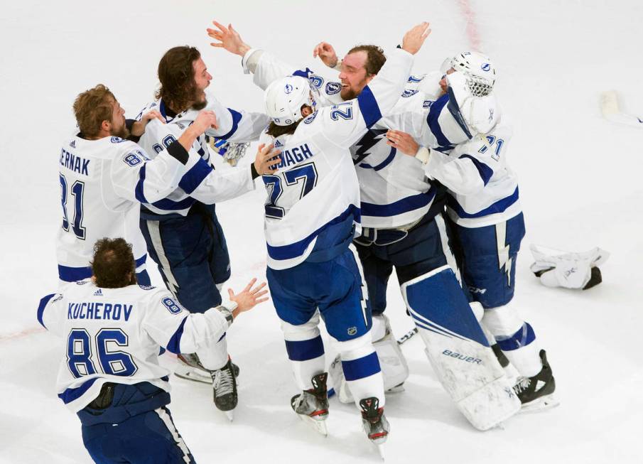 Tampa Bay Lightning players celebrate after defeating the Dallas Stars to win the Stanley Cup i ...