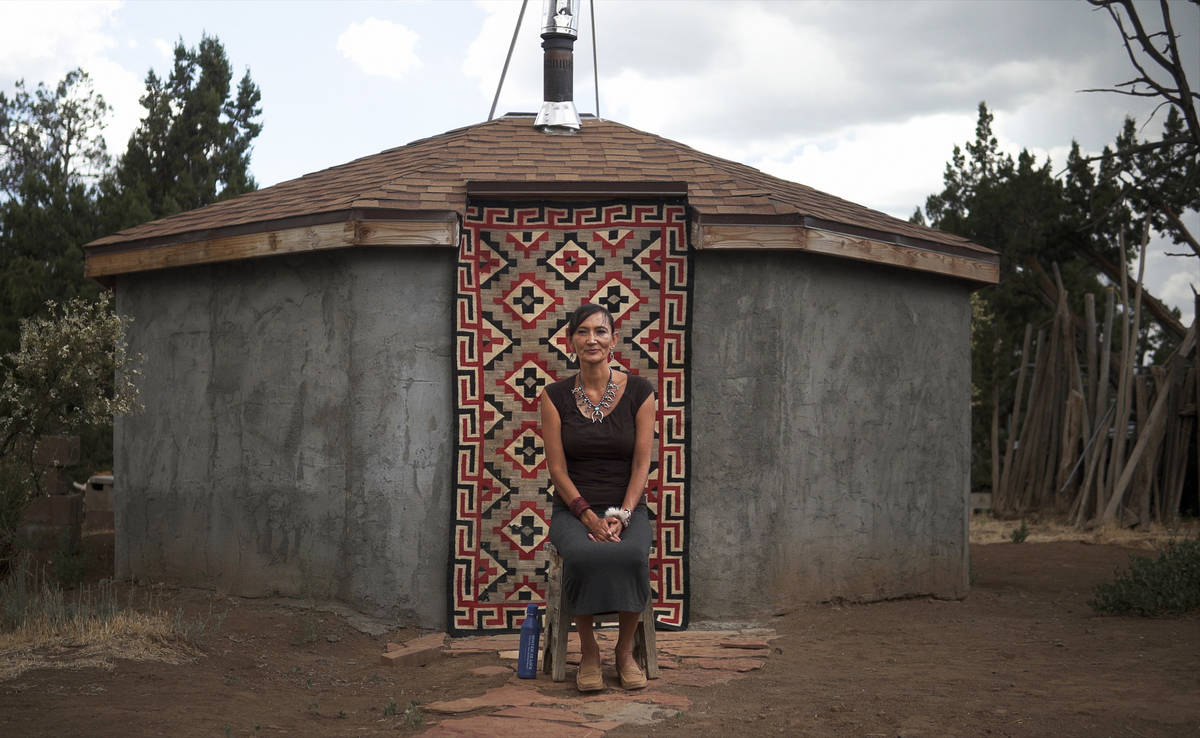 Jeneda Benally sits in front of her family's Hogan in Flagstaff, AZ, on Aug. 1, 2020, where her ...