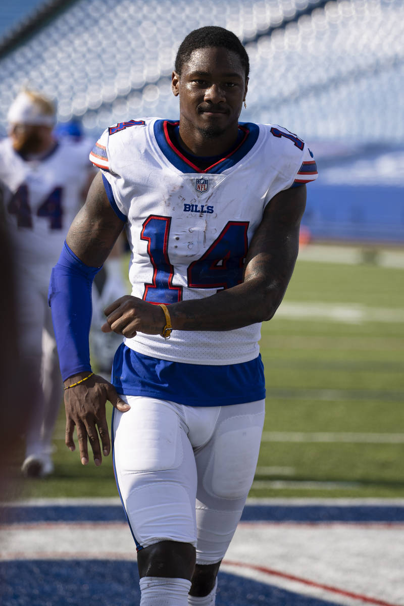 Buffalo Bills wide receiver Stefon Diggs (14) dances as he walks off the field after an NFL foo ...