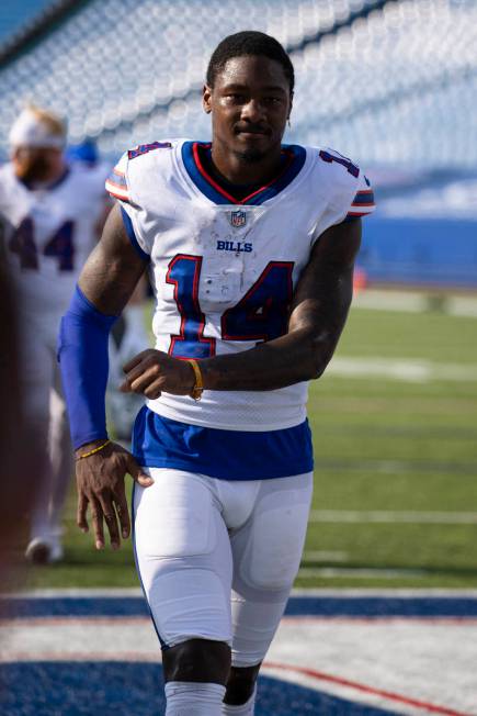 Buffalo Bills wide receiver Stefon Diggs (14) dances as he walks off the field after an NFL foo ...