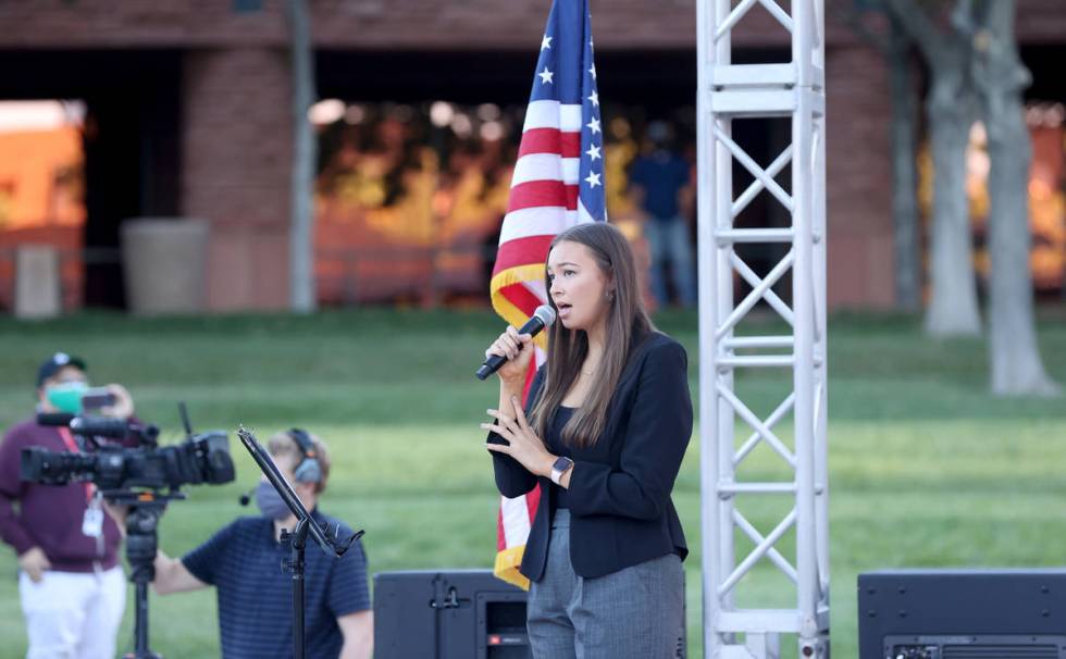 Paige Poggione sings during the 1 October Sunrise Remembrance ceremony at the Clark County Gove ...